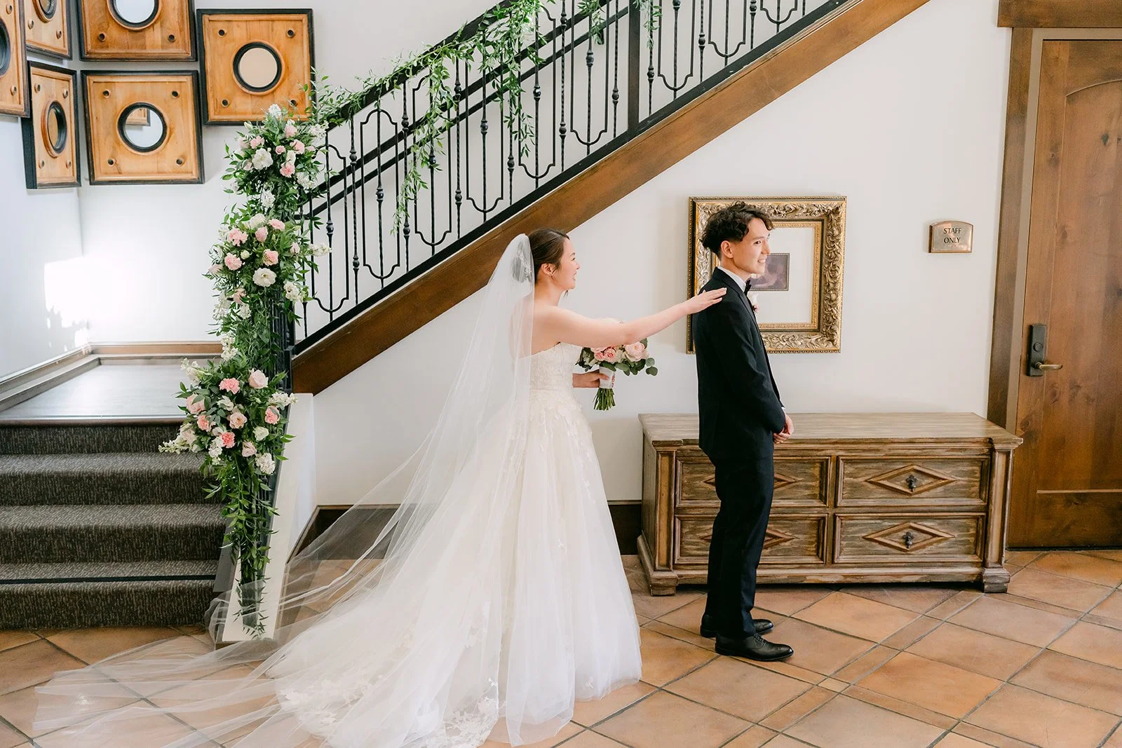 Bride tapping the groom's shoulder for the first look
