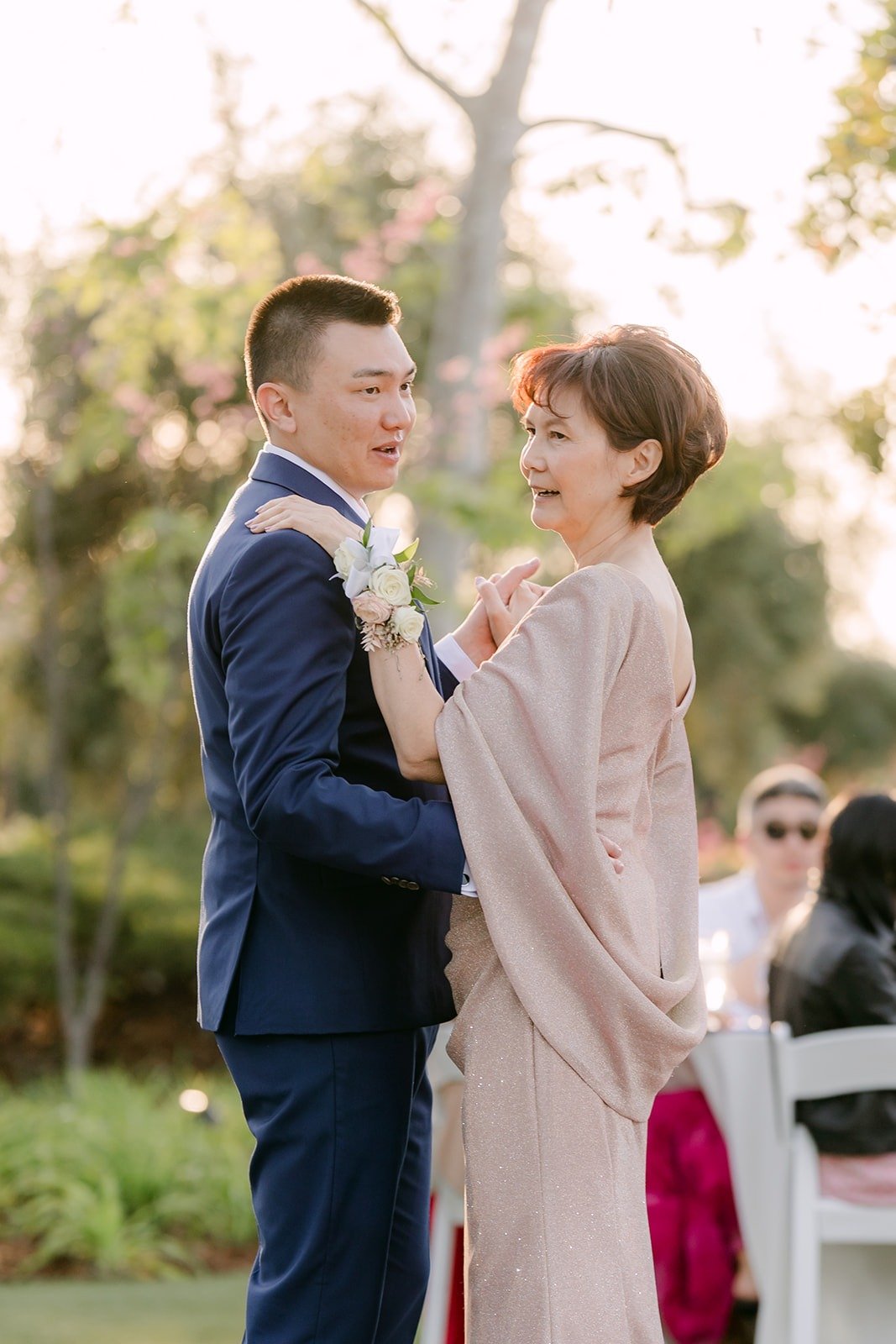 Alex smiling with his mom at the end of their dance, photographed by One and Only Production