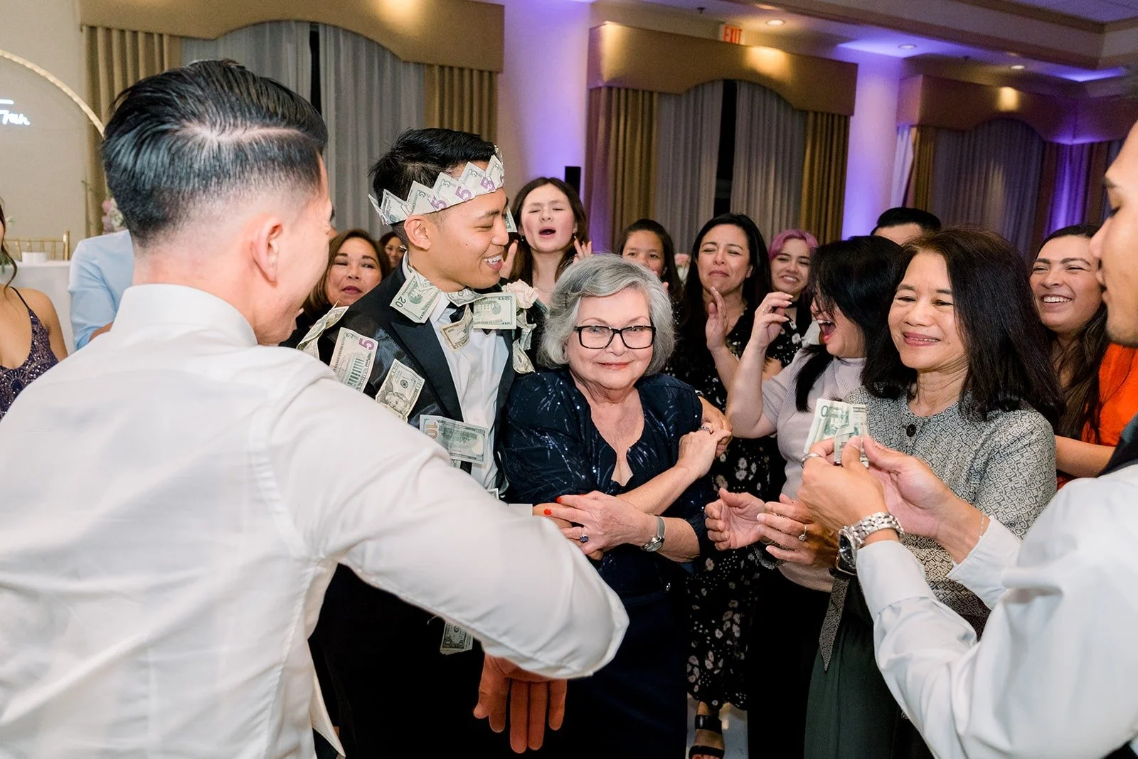 Ralph dancing with guests during the money dance