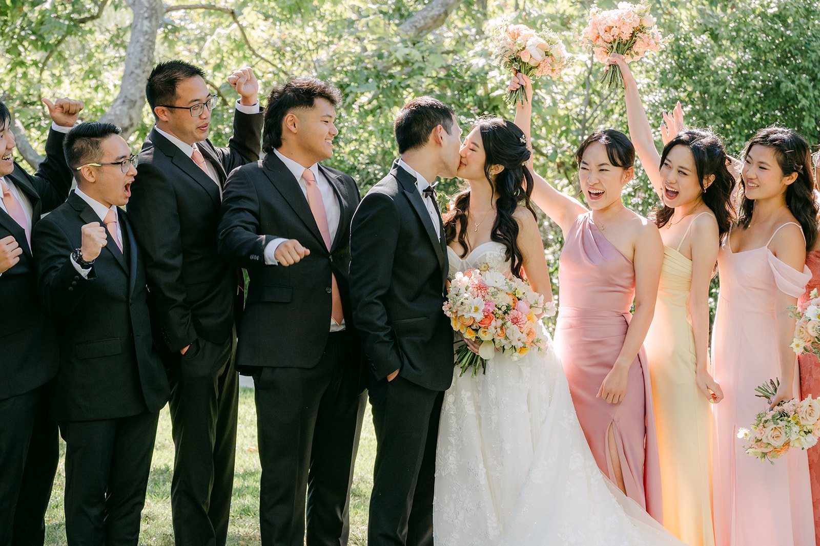 Groomsmen and bridesmaids paired up around Clarissa and Austin