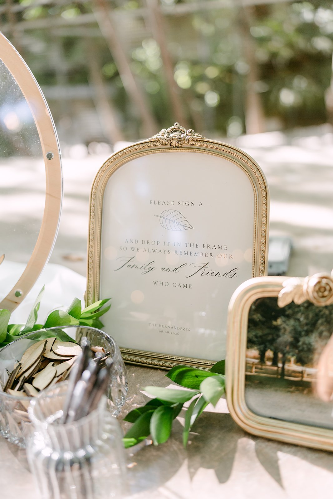 Gold framed welcome sign for Nicole and Caryl's ceremony.