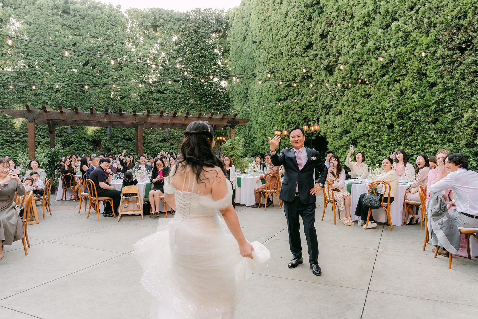 Chorok dancing with her dad in the courtyard