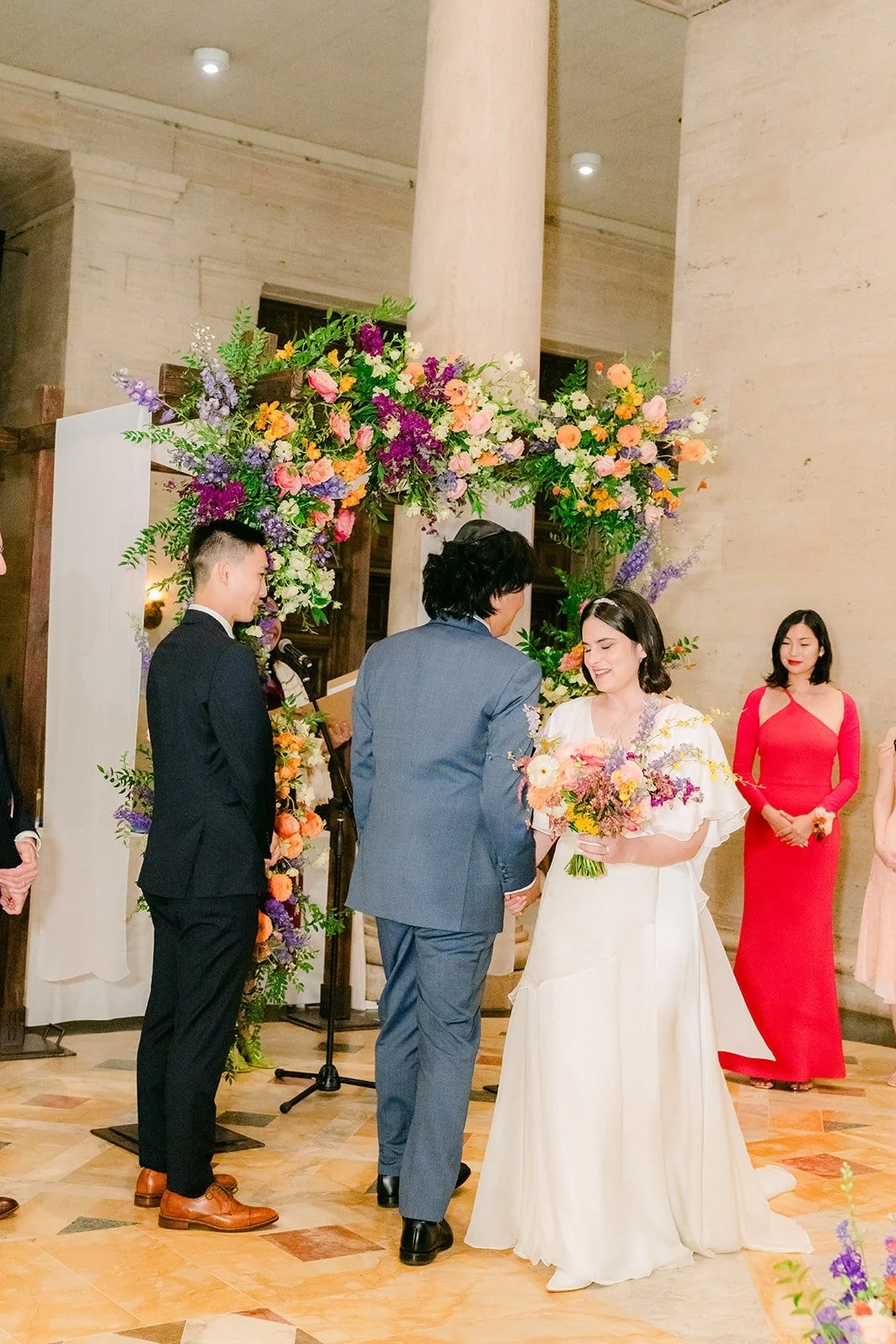 Jessie and Philip arriving at the floral arch