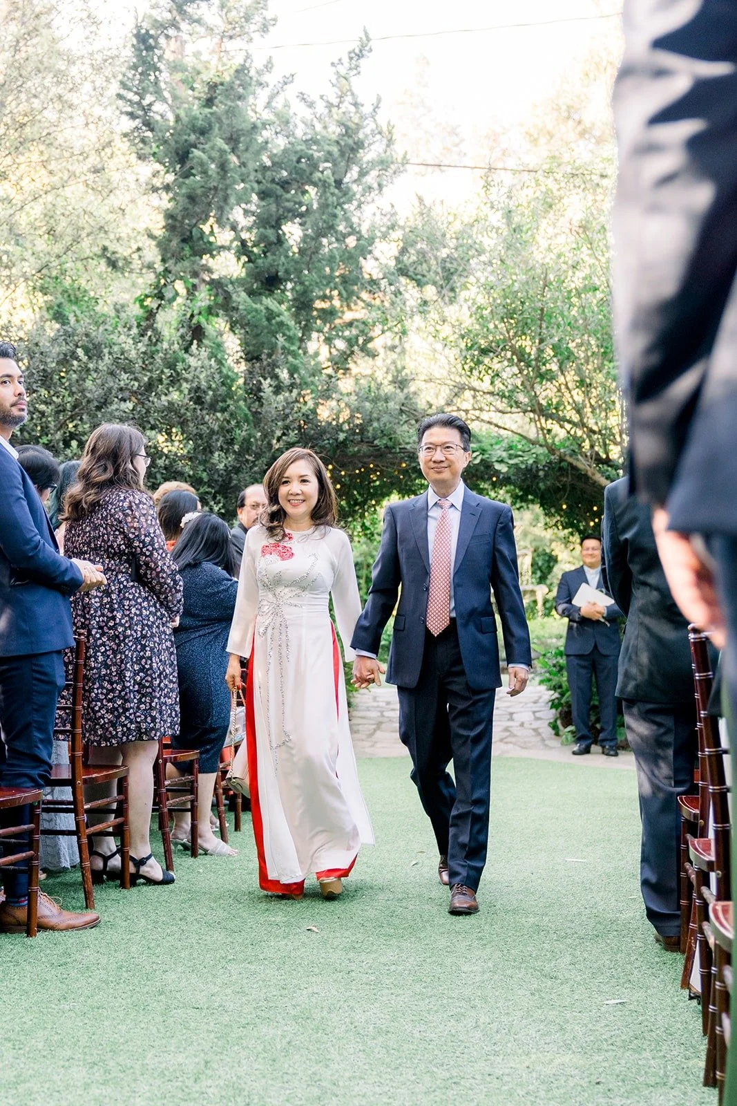 Guests cheering as Hannah and Vincent leave the ceremony