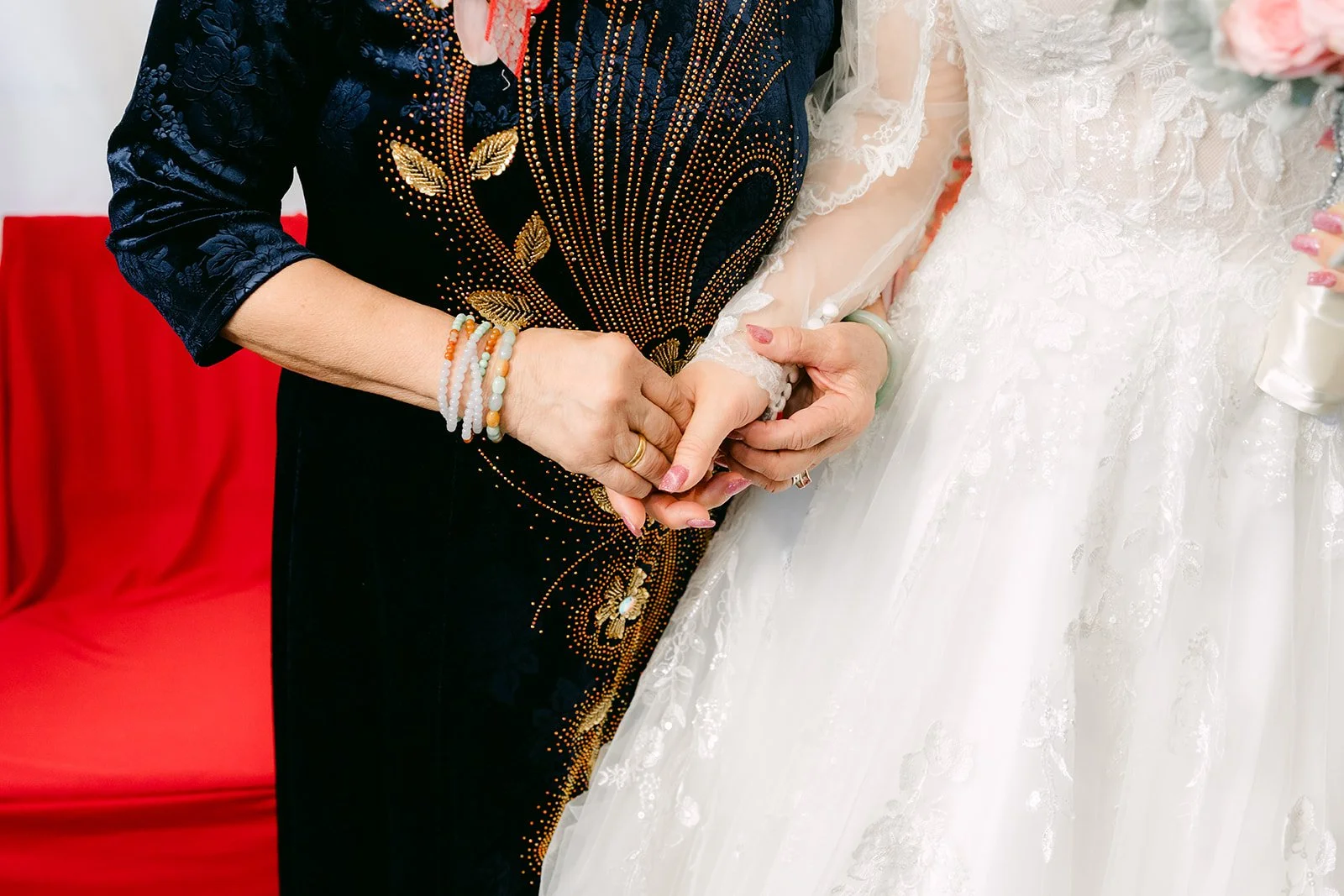Close-up of Vanessa's mom placing her hand in Ryan's.