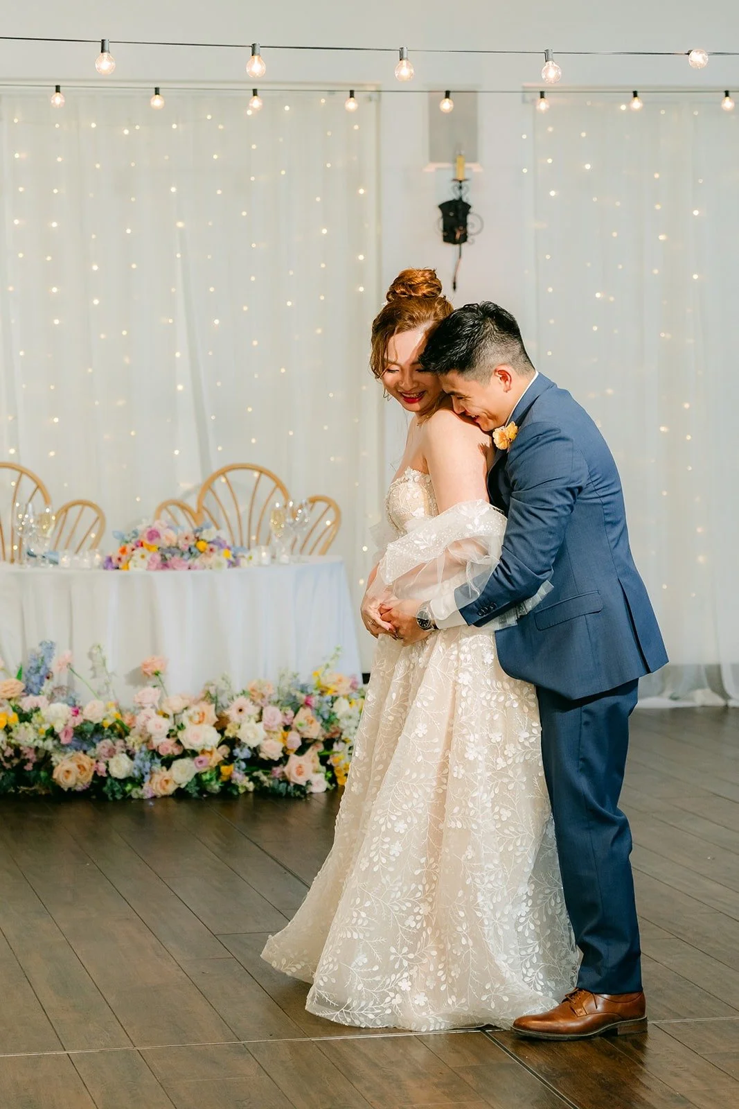Joanna and Jerrick ending their first dance with a hug