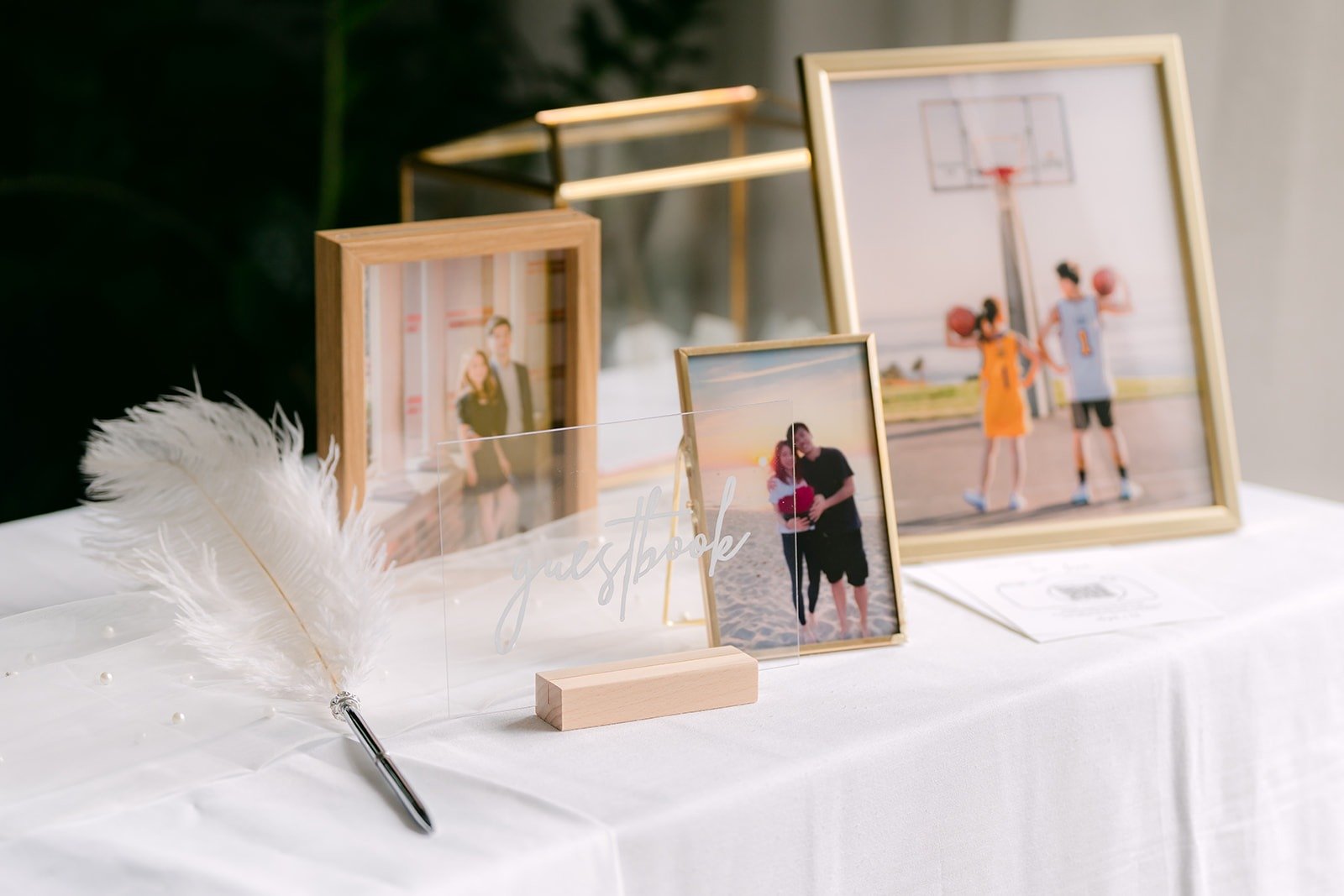 Framed photos and the guest book on the welcome table