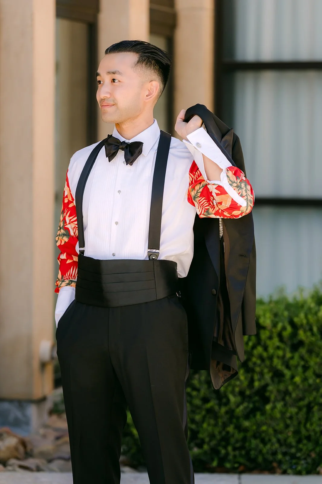 Vincent showing off the custom red floral lining of his tuxedo jacket
