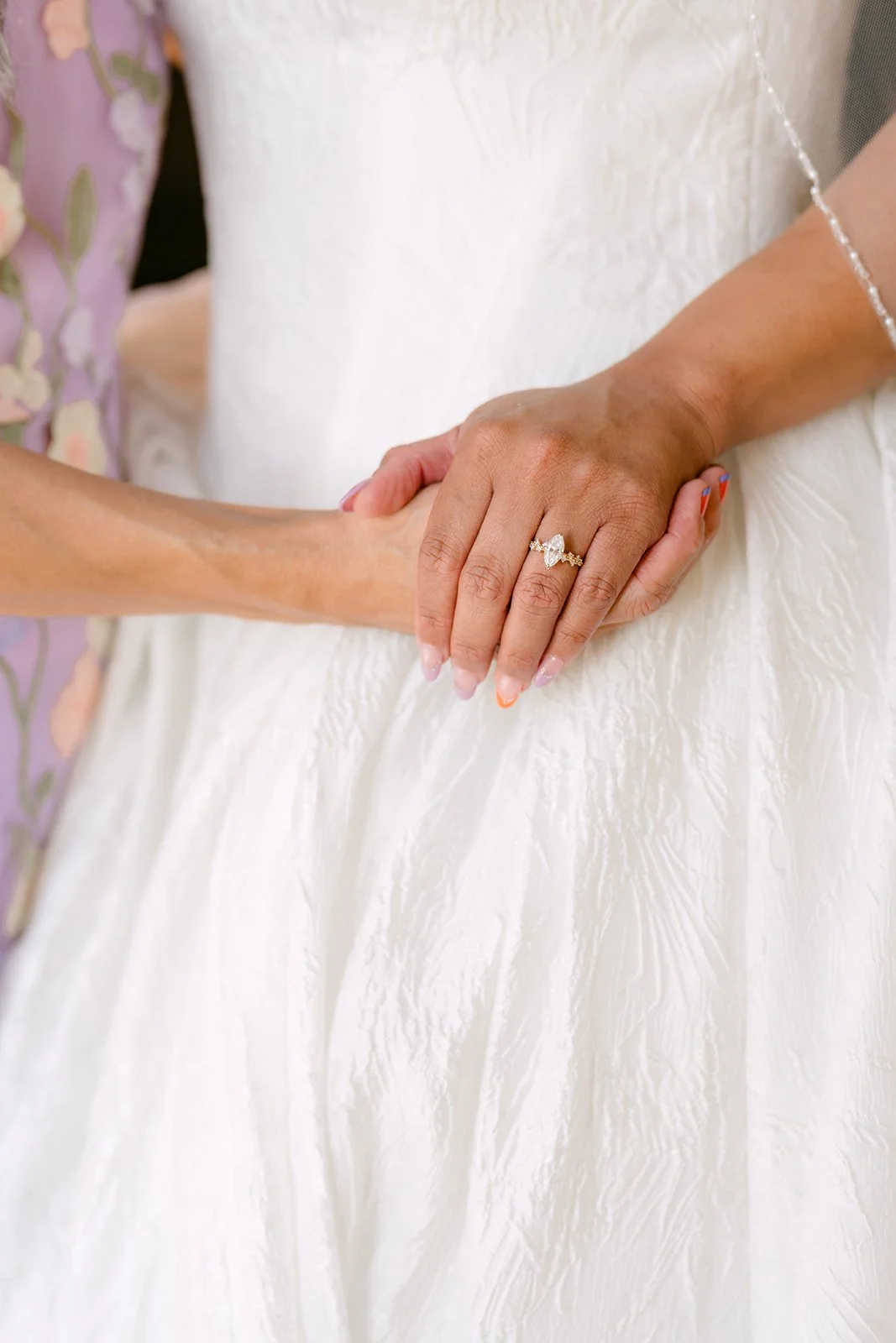 Mother and daughter holding hands