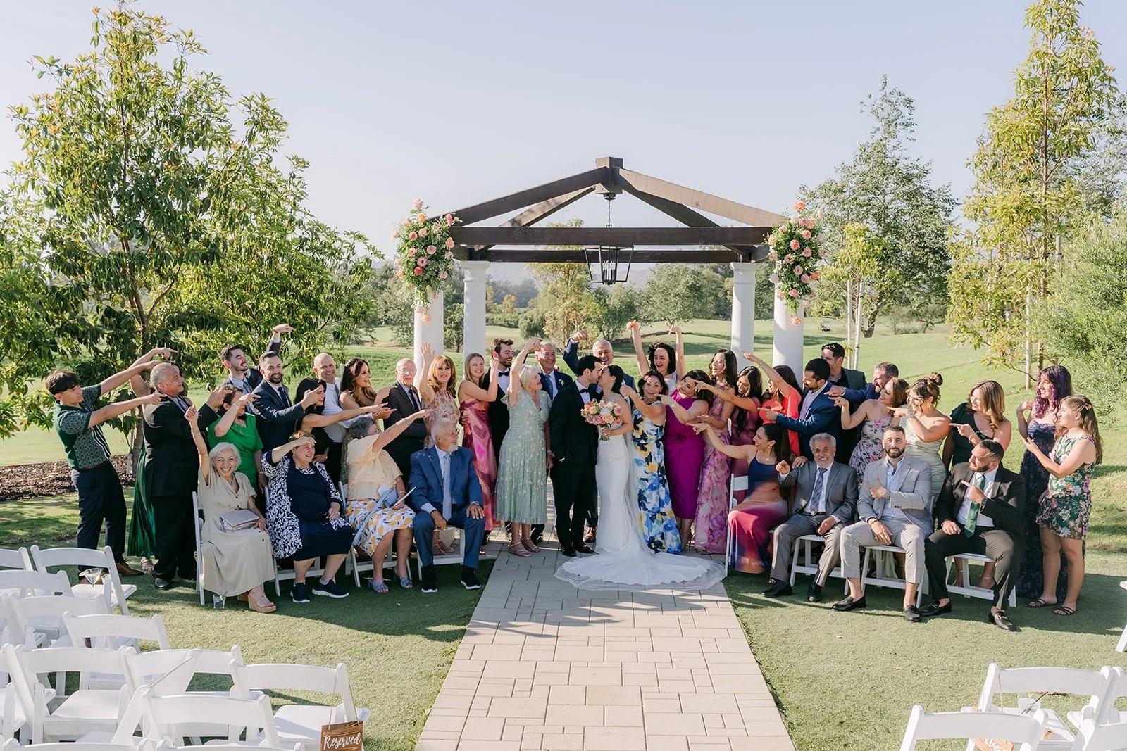 All of Stephanie and Kevin's guests gathered in front of the pagoda for a group photo