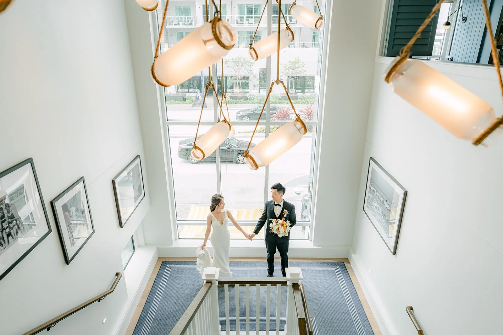 Angela and Eli at the foot of the grand staircase