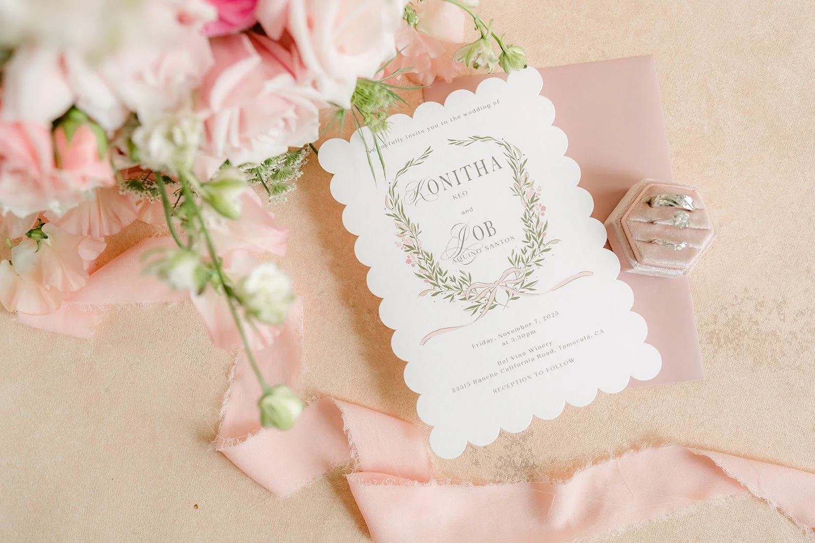 Konitha and Job's invitation with blush roses and ribbon at Bel Vino Winery