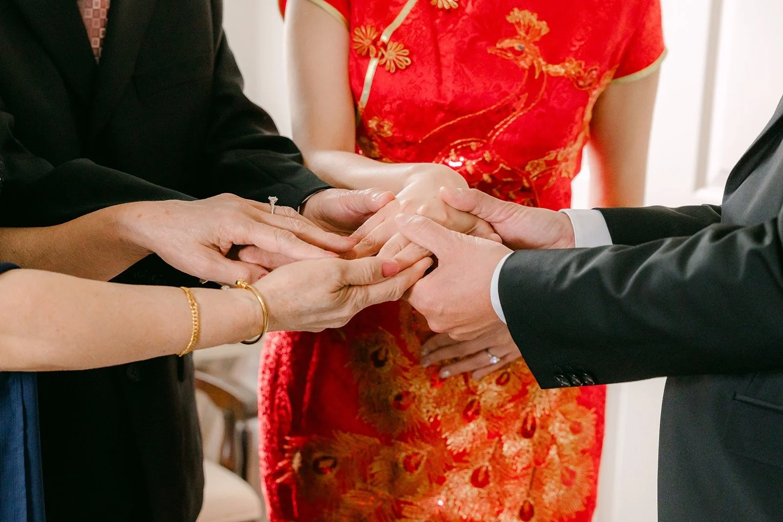 Close up of hands joined as the family greets Eric