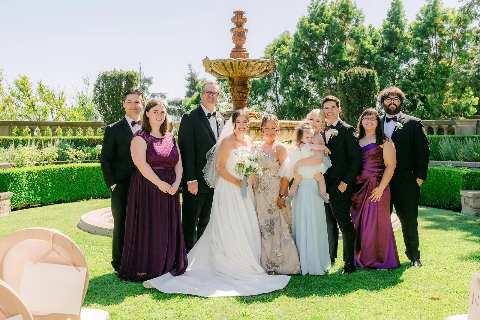 Brianna and Nik with extended family by the fountain