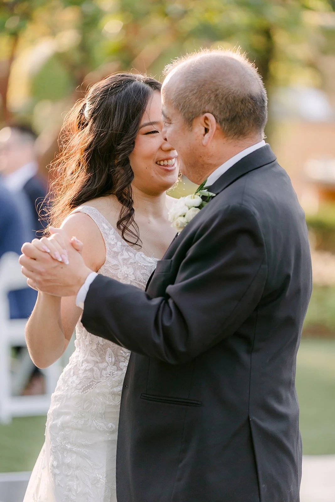 Kelli laughing with her dad during their dance