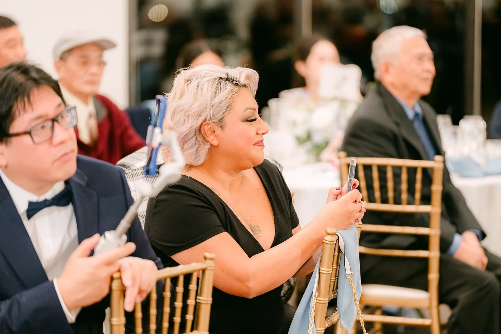 Guests react during the speeches