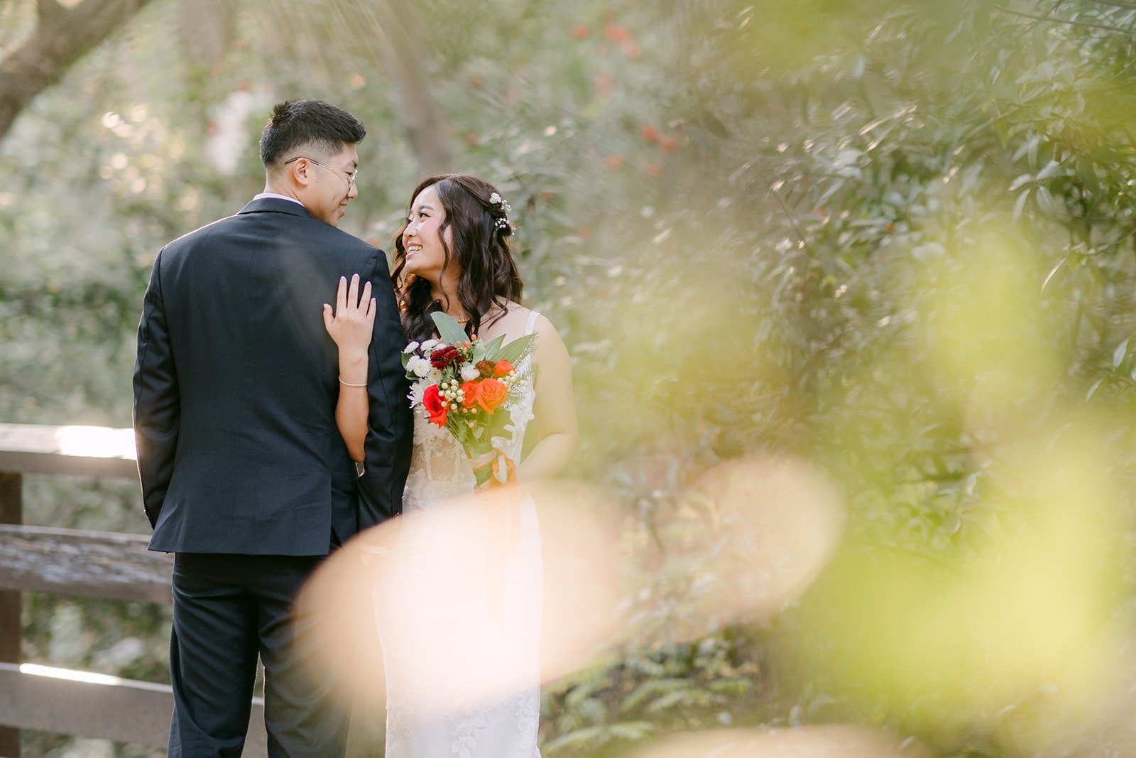 Shayna and Robert in soft light at the edge of the trees