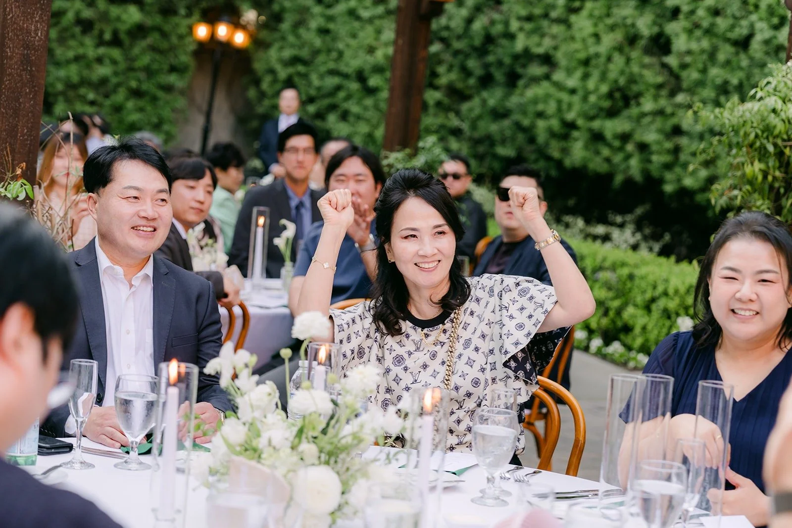 Guests cheering from their tables during the grand entrance