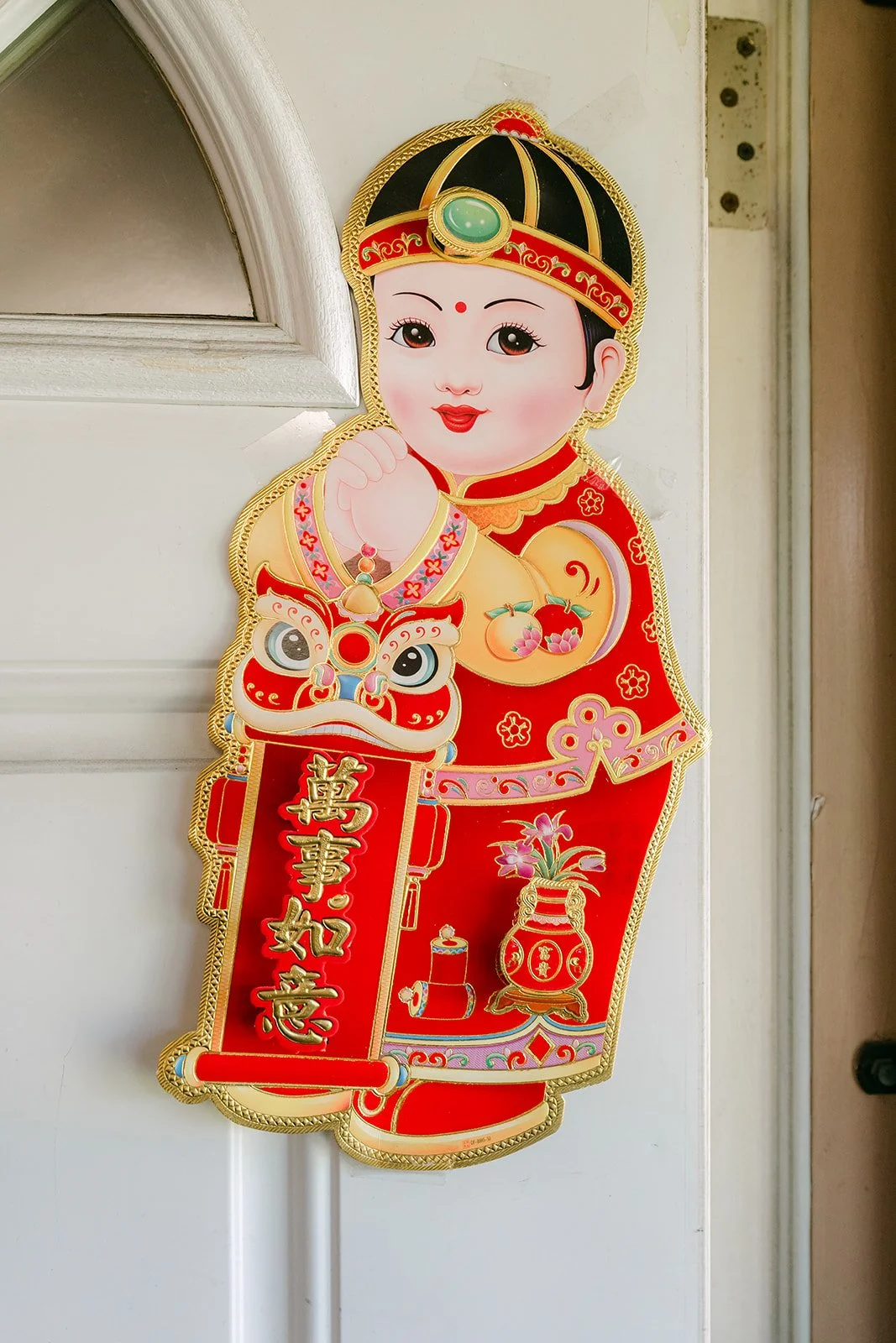 Traditional doll decoration on the front door, photographed by One and Only Production.