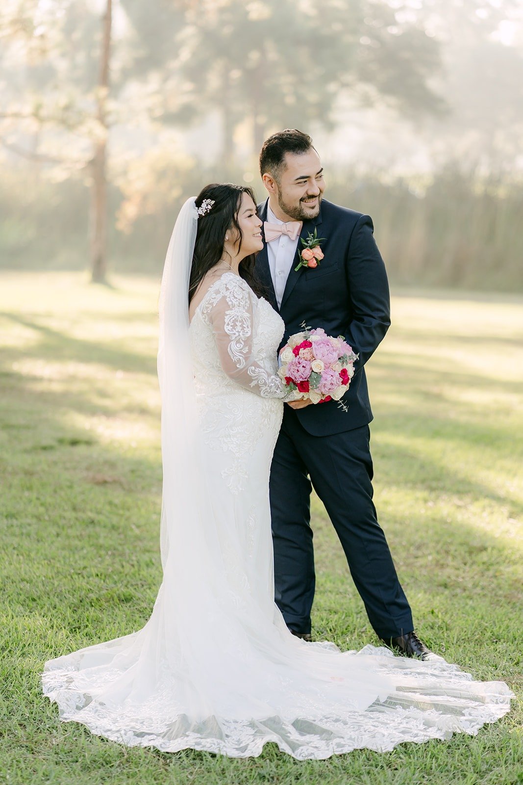 James holding Amy close as her train spreads across the grass