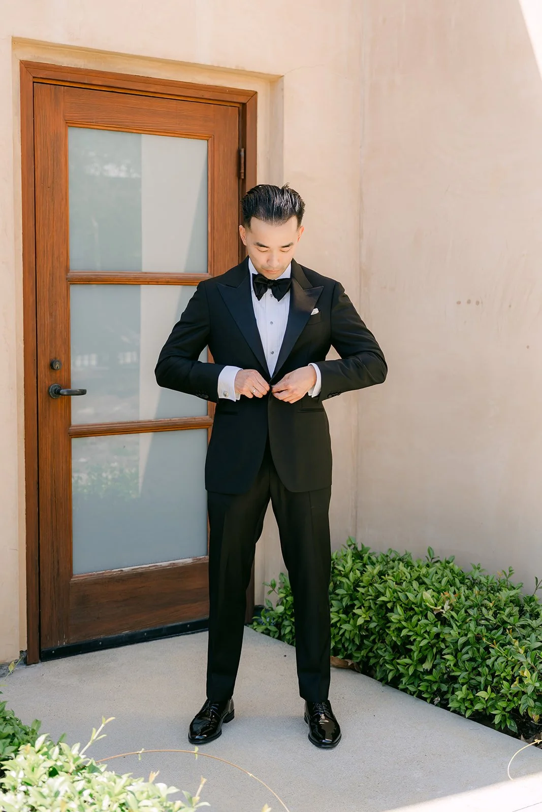 Vincent in his black tuxedo outside St. John Fisher Church