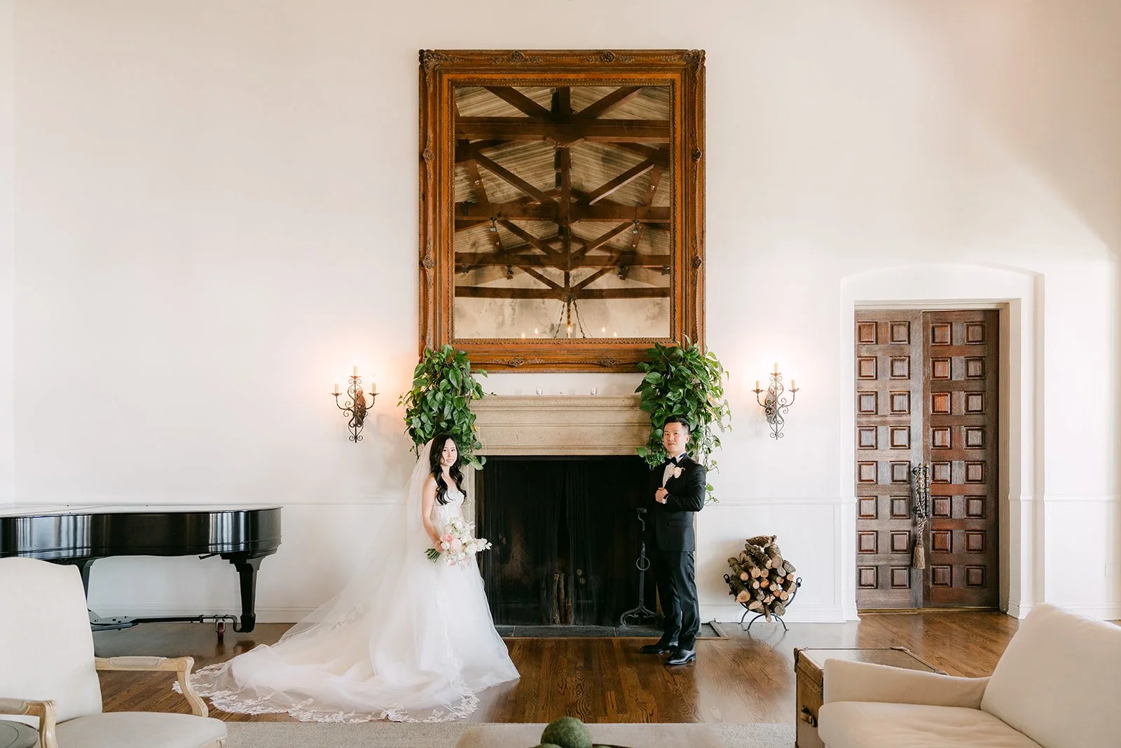 Couple by the carved fireplace in the clubhouse lounge