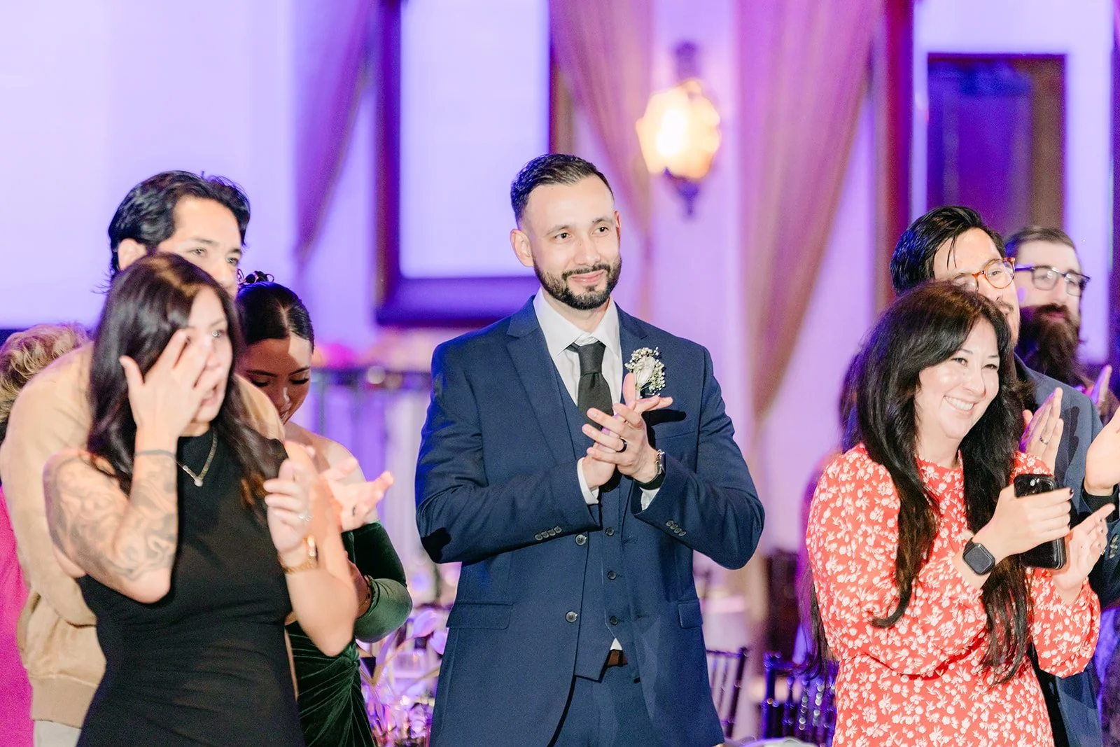 Guests wiping away tears during the parent dances