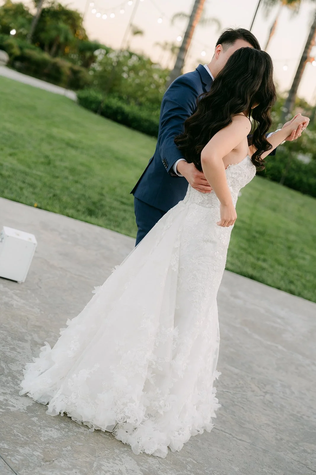 Elijah spinning Vannie on the lawn during their first dance.