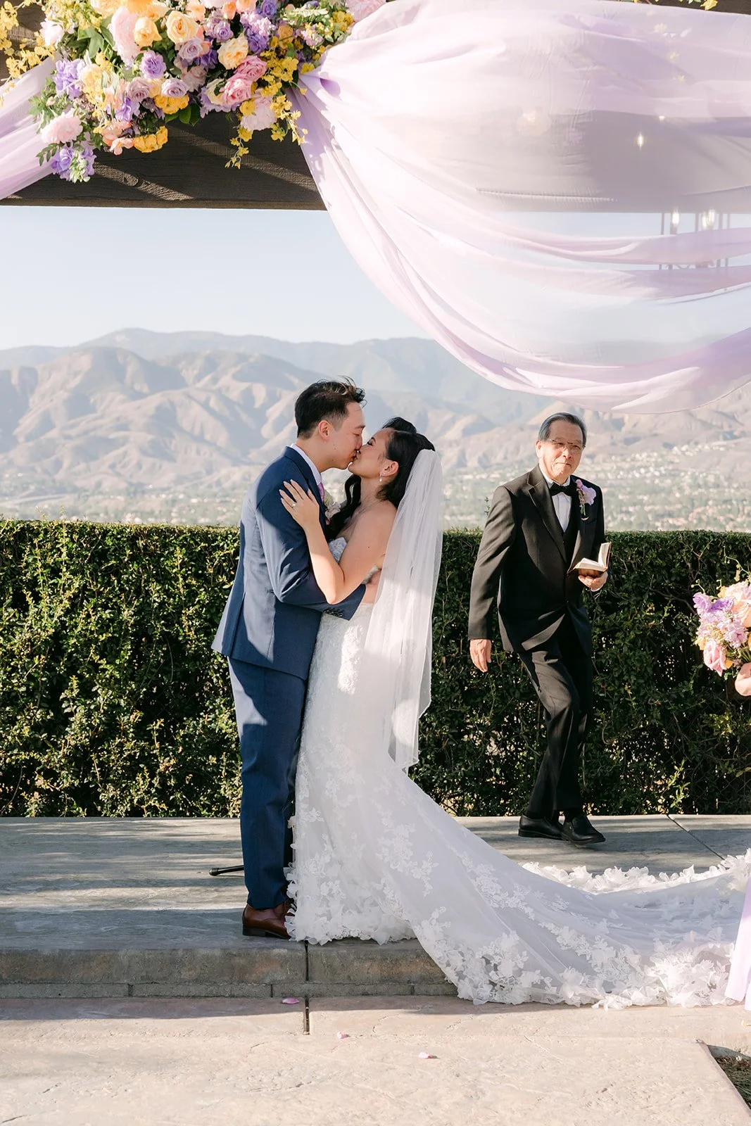 Vannie and Elijah's first kiss under the pergola.