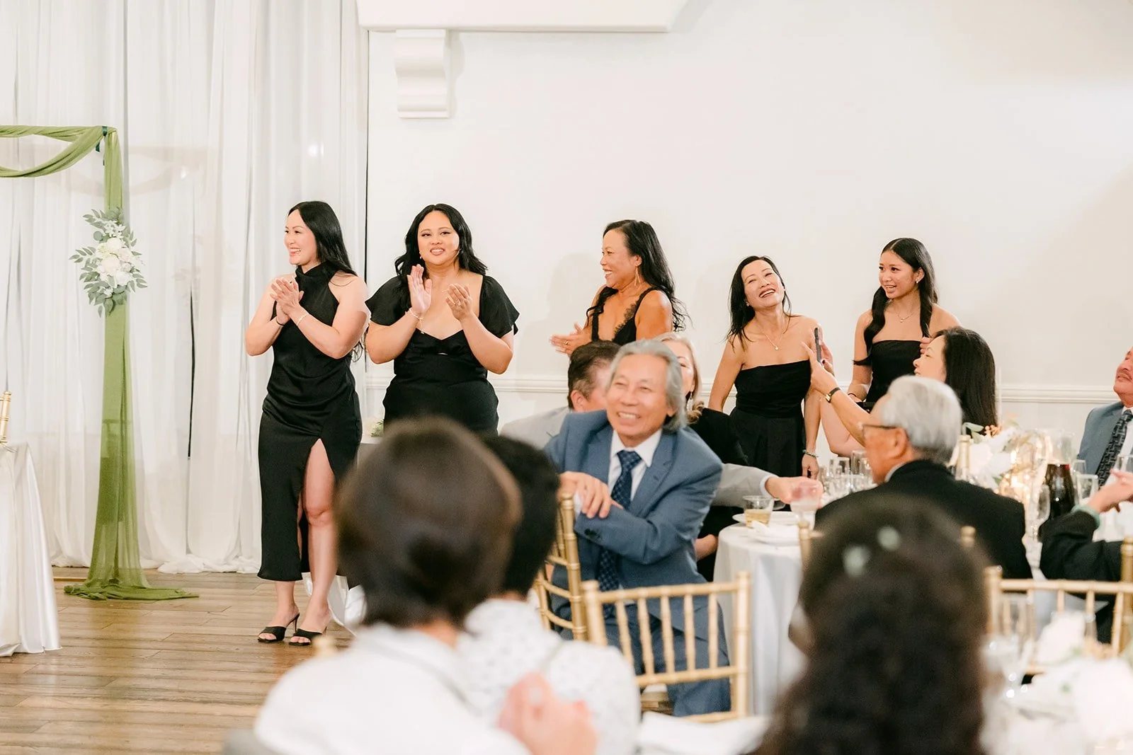 Guests cheering for the wedding party