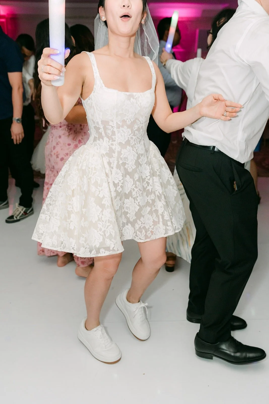 Kylie dancing in her short lace dress and sneakers