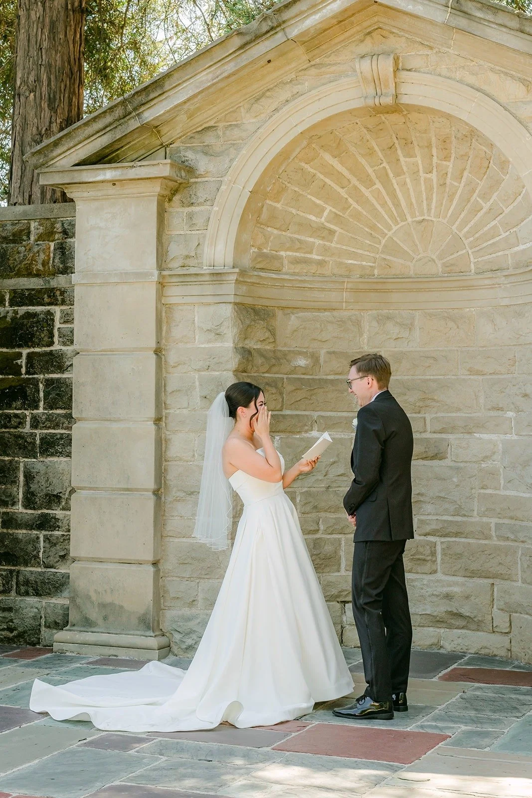 Brianna and Nik sharing private words in the stone alcove