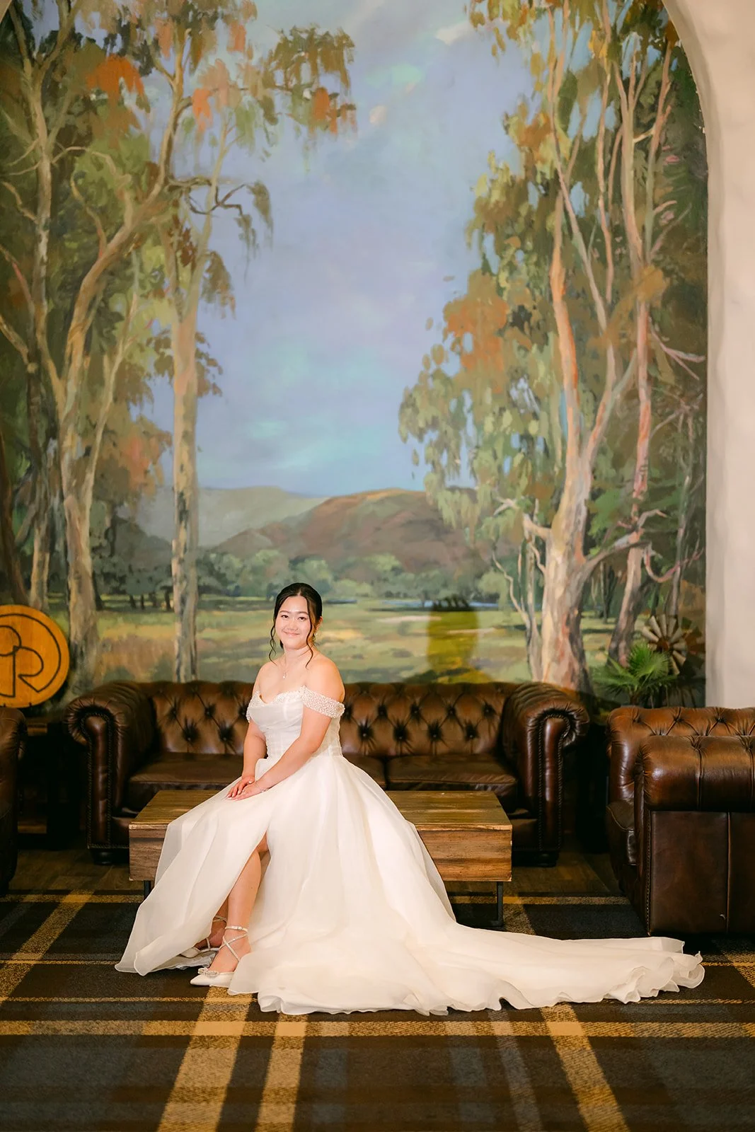 Bridal portrait of Jessica on the leather sofa