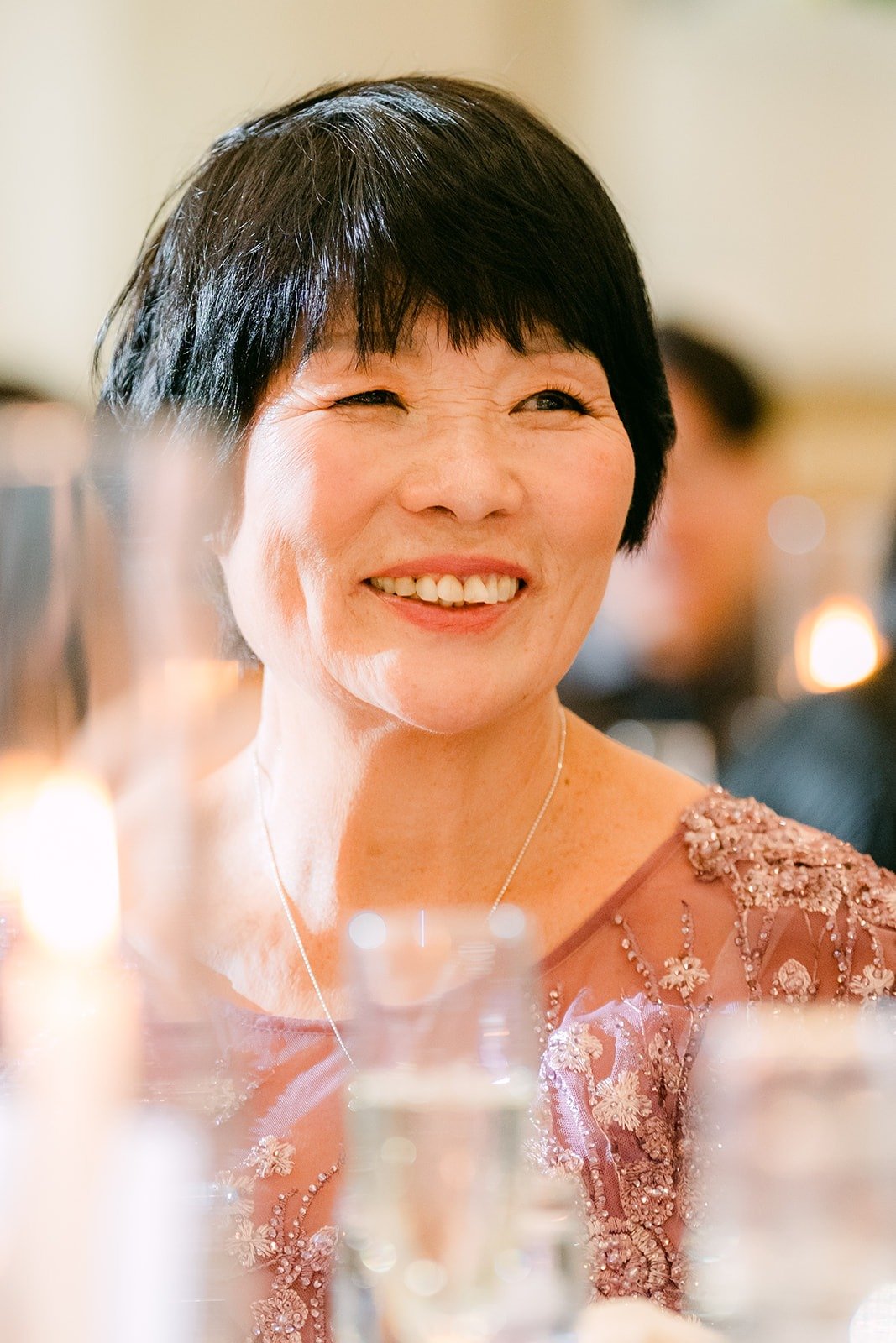 A guest smiling during the speeches