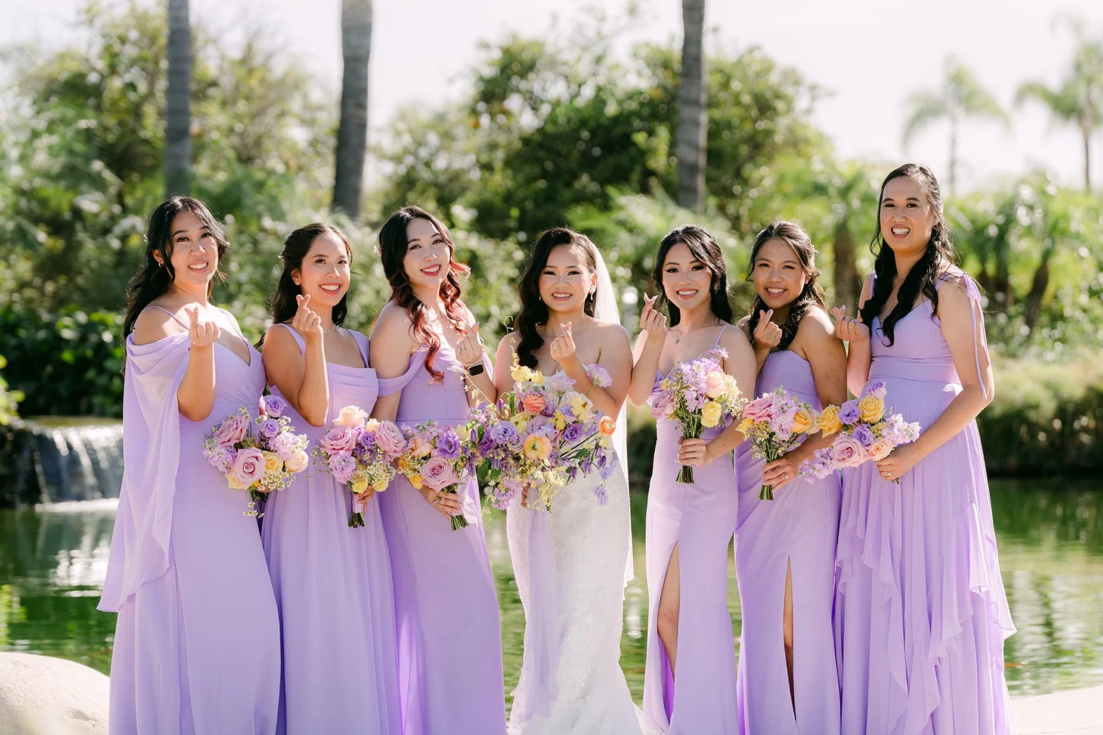 Vannie and her bridesmaids by the pond at The Grove of Redlands.