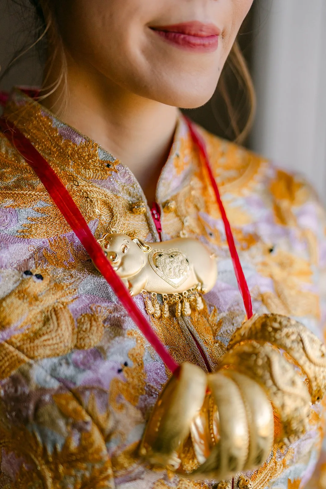 Close detail of the gold jewelry Christie received during the tea ceremony.