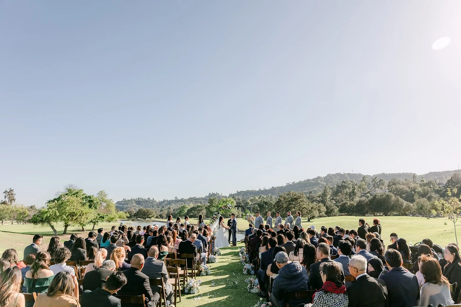 A wide view of the ceremony on the 15th hole with the hills in the distance