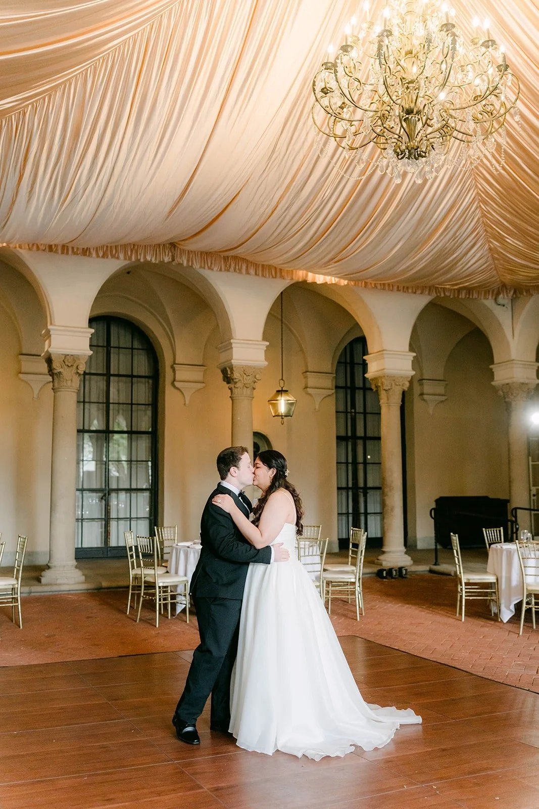 Saira and Matthew holding each other at the end of their first dance, photographed by One and Only Production