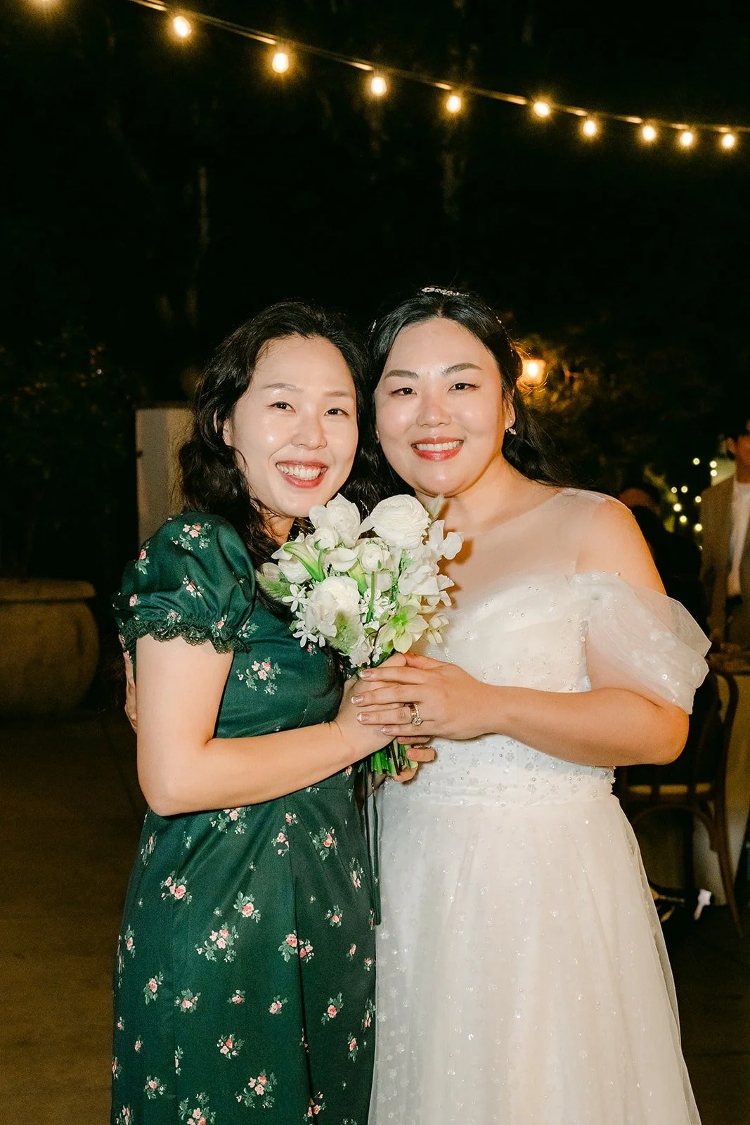 Chorok with the guest who caught the bouquet, photographed by One and Only Production