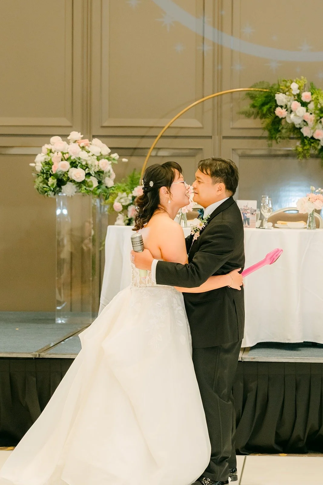 Stella and James hugging at the end of their first dance, photographed by One and Only Production