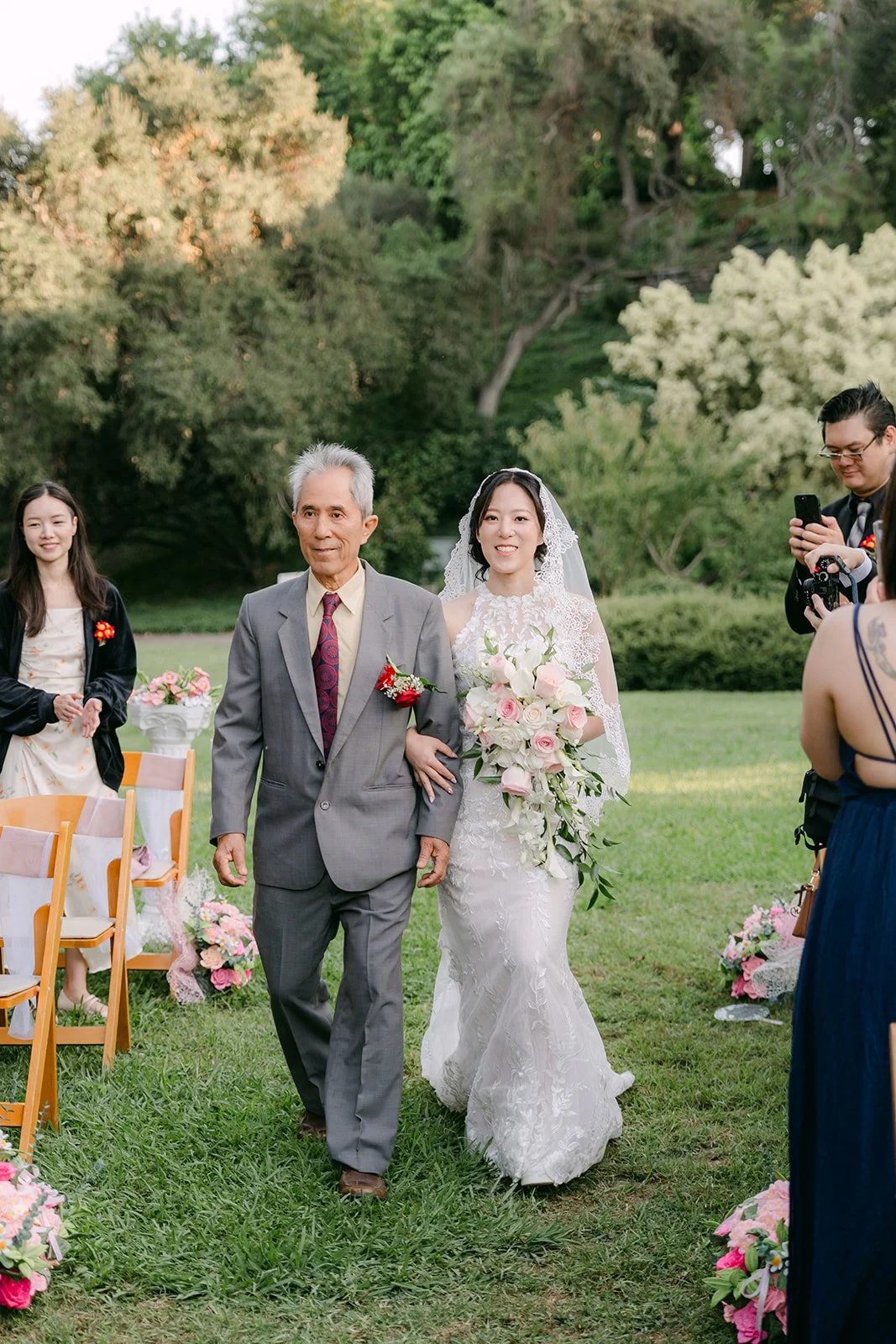 Elaine being walked down the aisle.