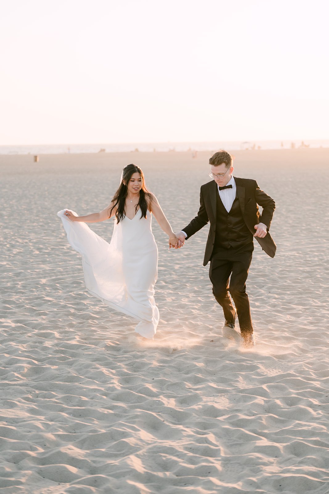 Running hand in hand across Venice Beach