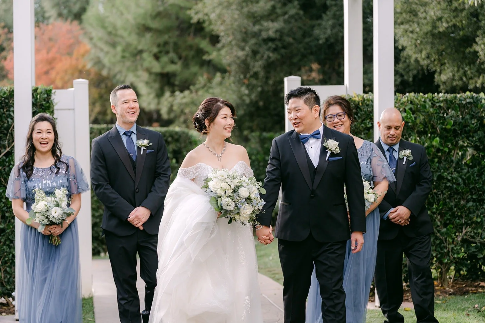Sochi and Jay with their wedding party on the ceremony lawn