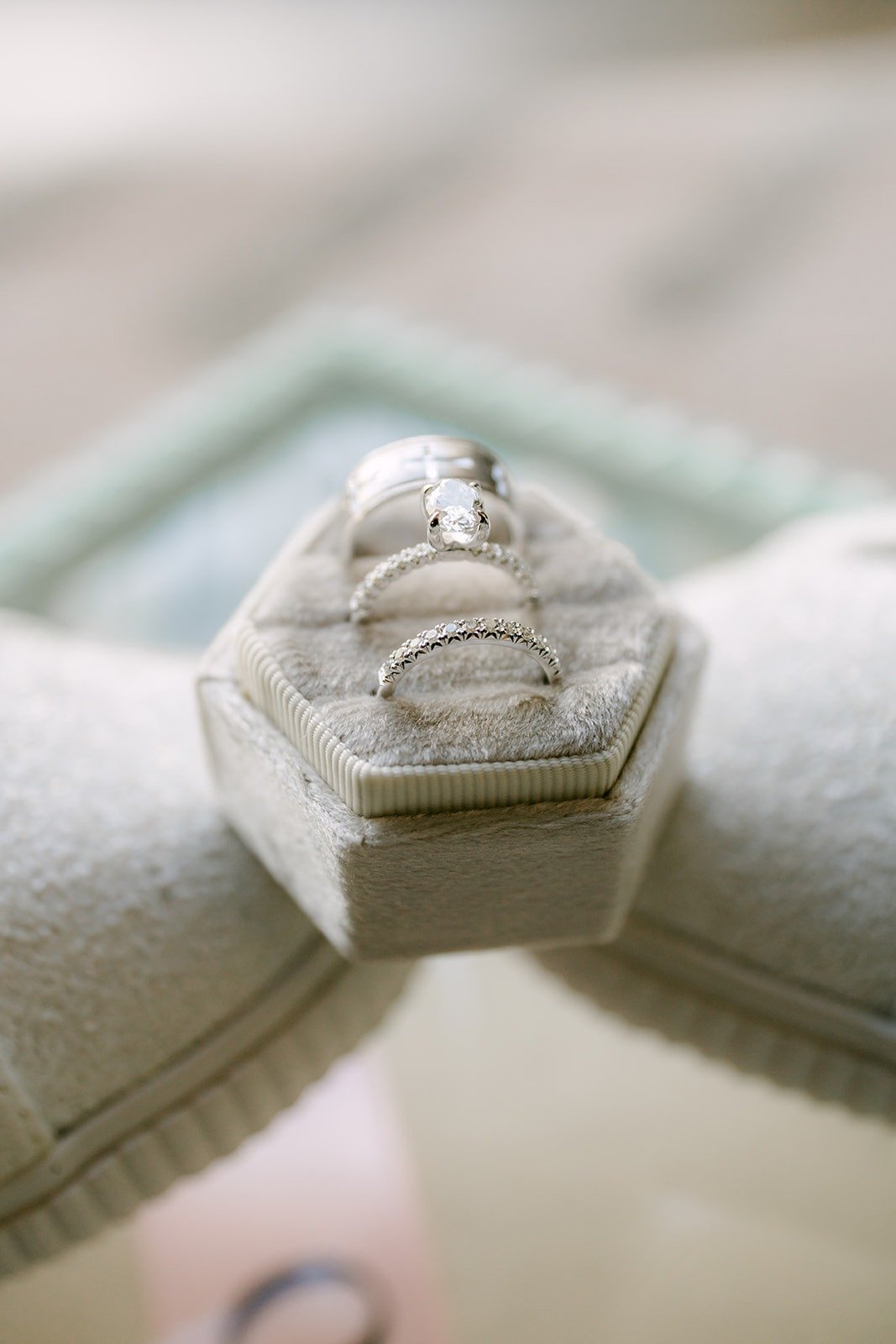 Wedding rings tucked in a velvet hexagon ring box