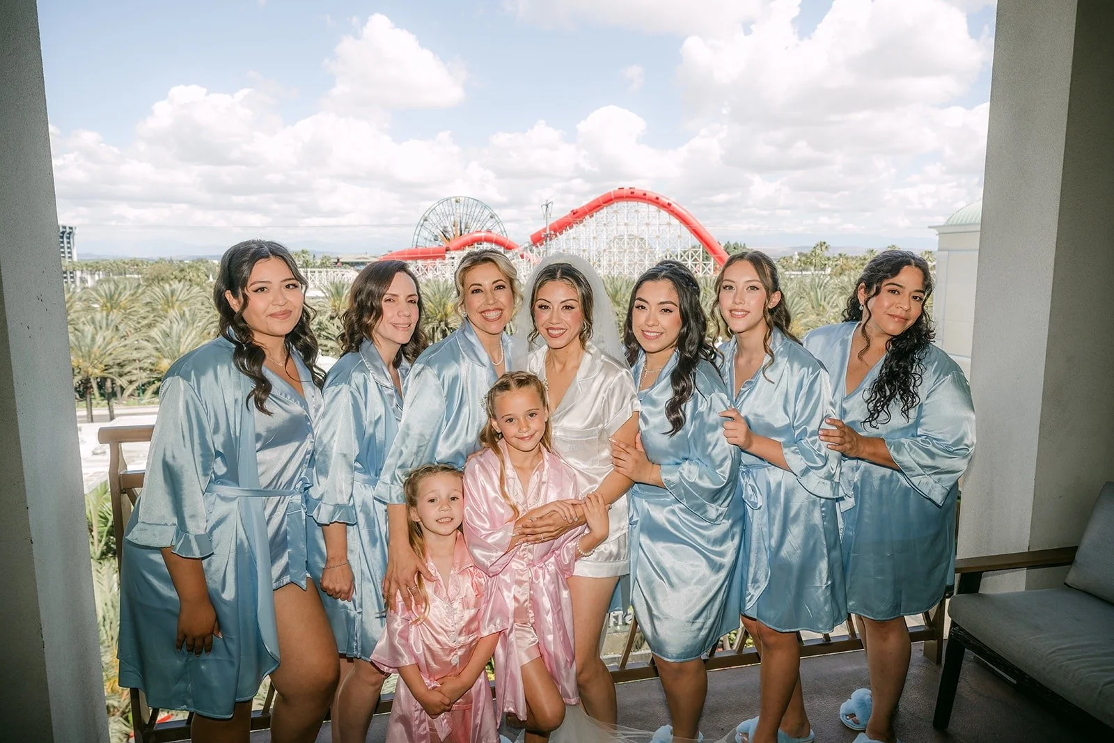 Francesca and her bridesmaids in matching robes on the Bride Suite balcony