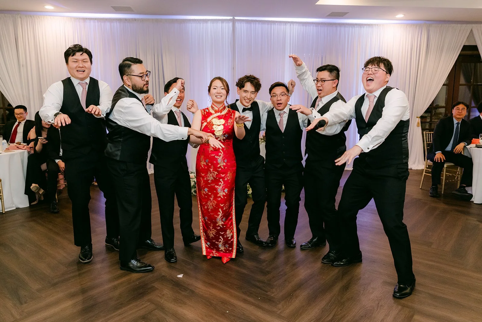 Groomsmen striking a final pose after the surprise dance with the bride