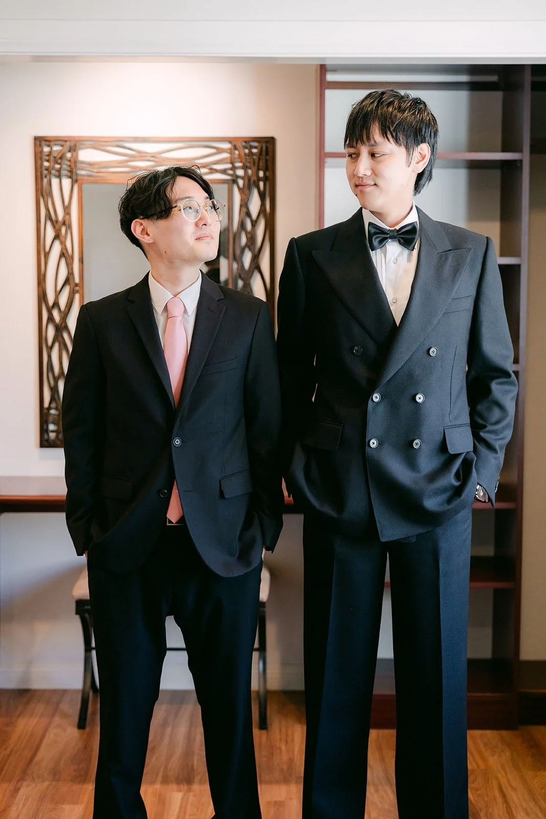 Job and a groomsman ready in the groom's suite