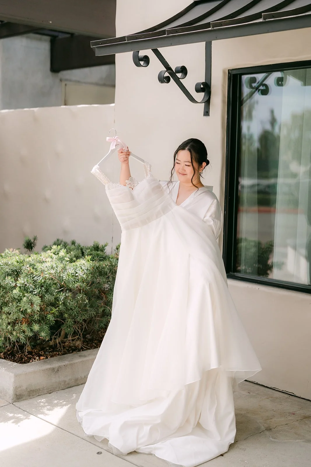 Jessica stepping into her gown
