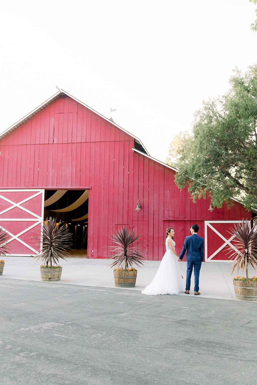 Ariel and Alex in front of the big red barn