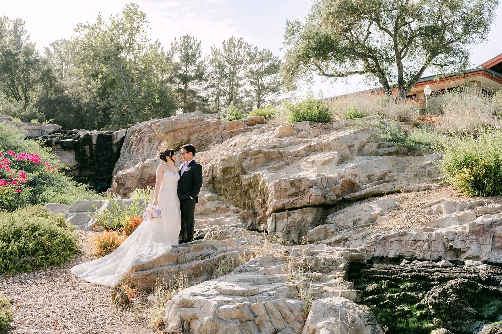 A wide portrait by the waterfall rocks